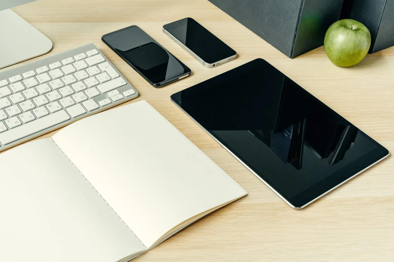 Digital devices on a modern office desk representing connected workflow automation tools and business systems