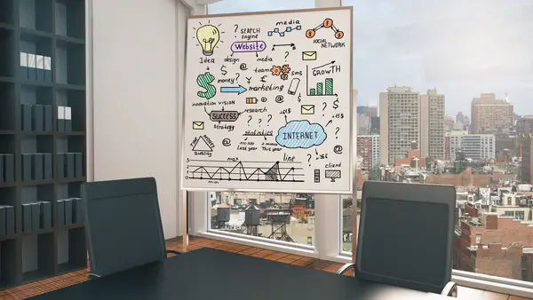 Whiteboard with business strategy sketches comparing technology leadership approaches