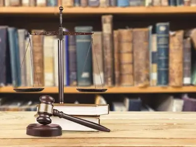 Law books and wooden gavel representing legal technology