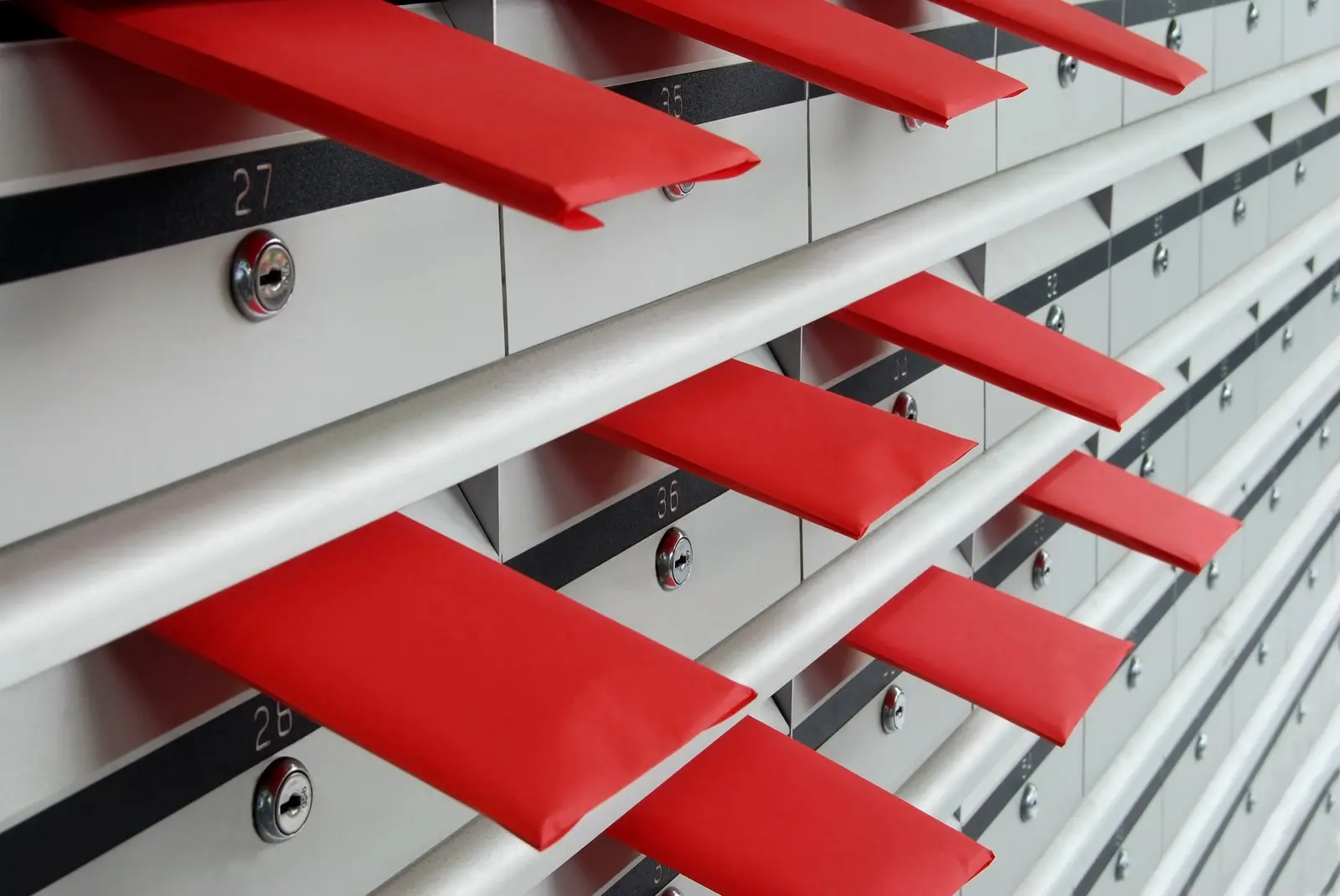 Rows of mailboxes with envelopes, representing automated email sequences and lifecycle marketing for small businesses