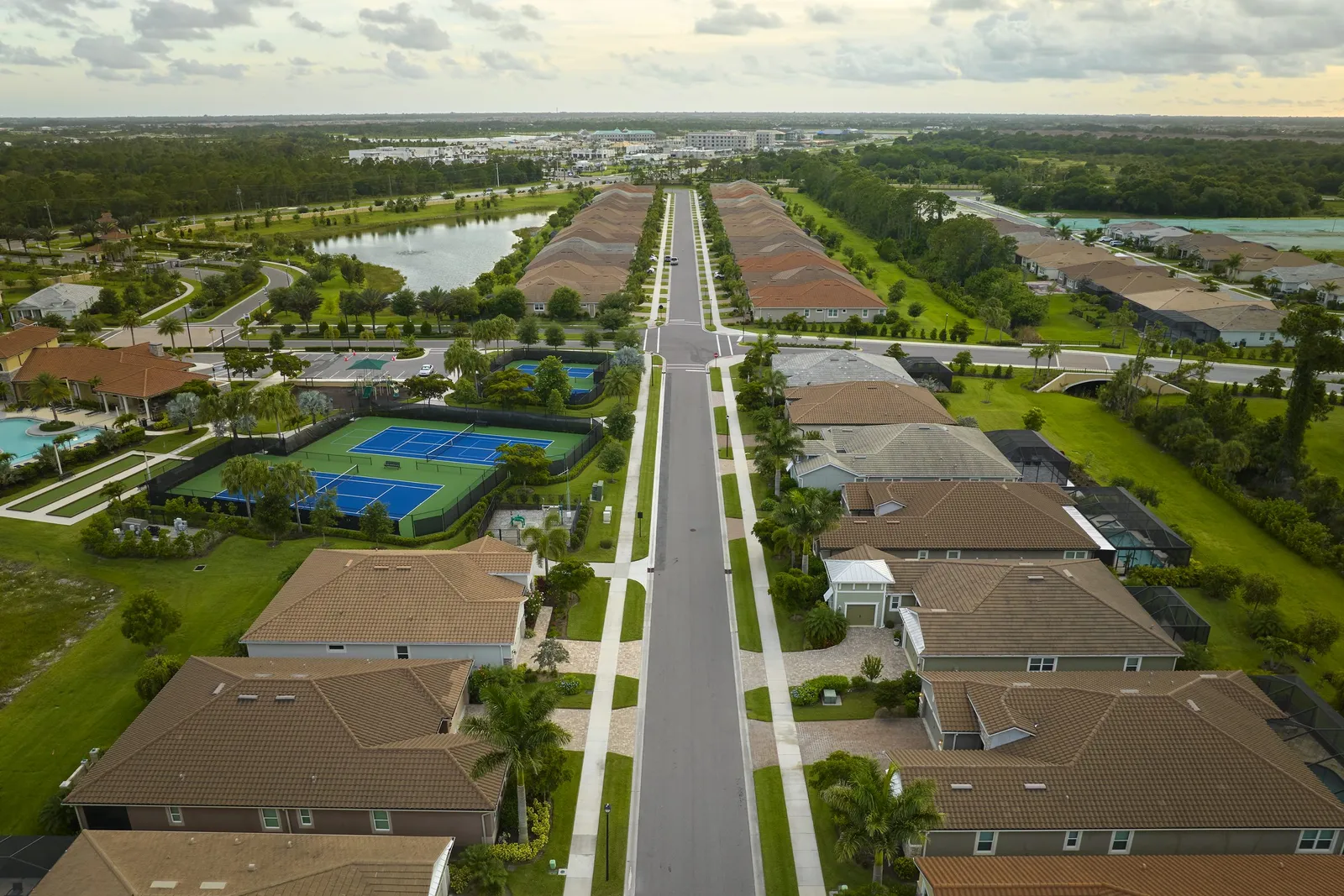 Aerial view of a Florida gated residential community with homes and greenery representing Orlando's booming real estate market