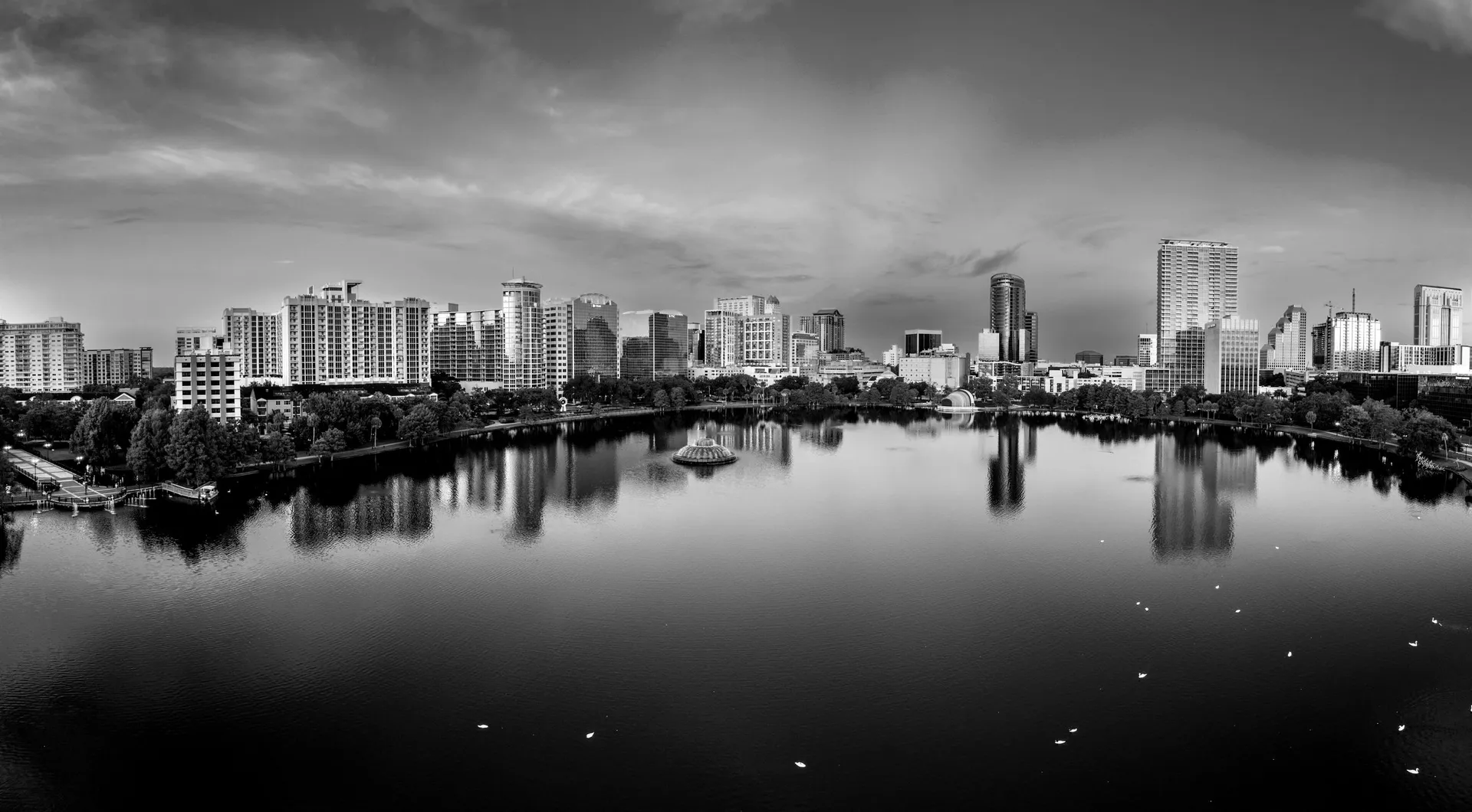 Aerial view of Orlando Florida skyline and Lake Eola at sunrise showcasing the growing Central Florida business and technology corridor