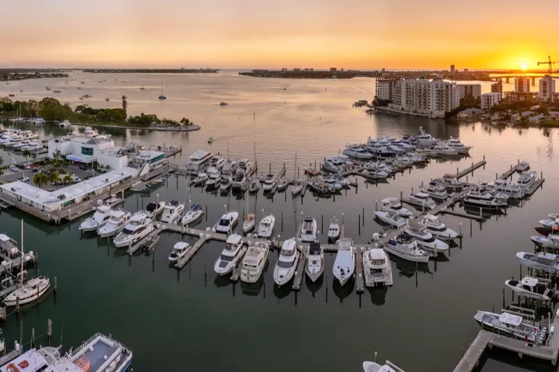 Yachts docked along Sarasota Bay at sunset, representing fractional CTO and technology leadership for businesses across the Sarasota and Manatee region