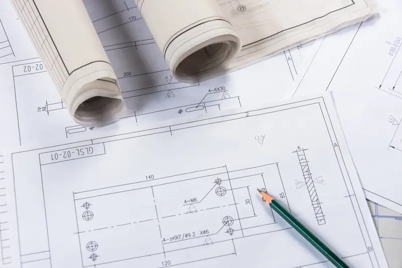 Architectural blueprints and technical drawings representing planned technology and marketing roadmapping for Sarasota businesses