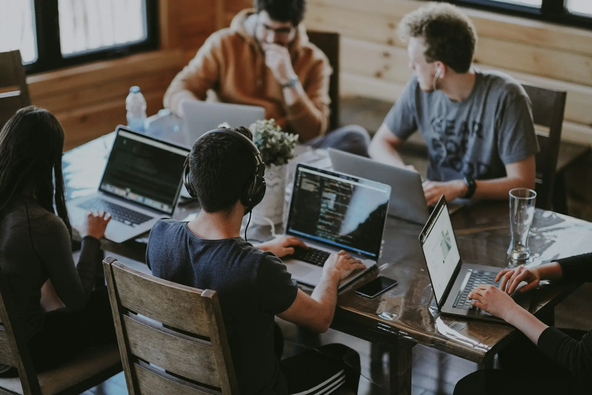 Cross-functional team collaborating on technology strategy with executive CTO guidance