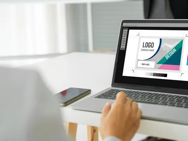 Developer workspace with code on laptop screen showcasing custom web design and development