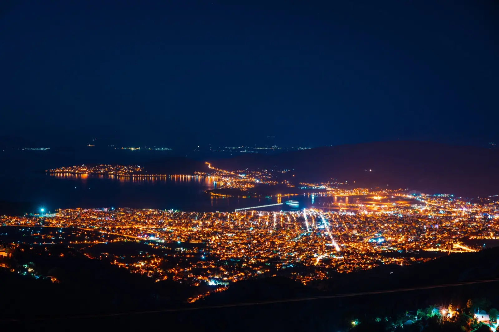 A city of lights seen from above at night, representing a business visible across many places online rather than in one