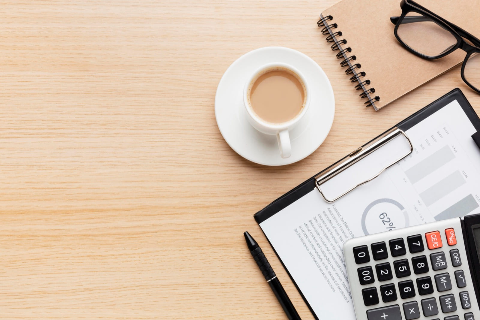 Payroll documents and reports on a desk, representing automated payroll processing for accounting practices
