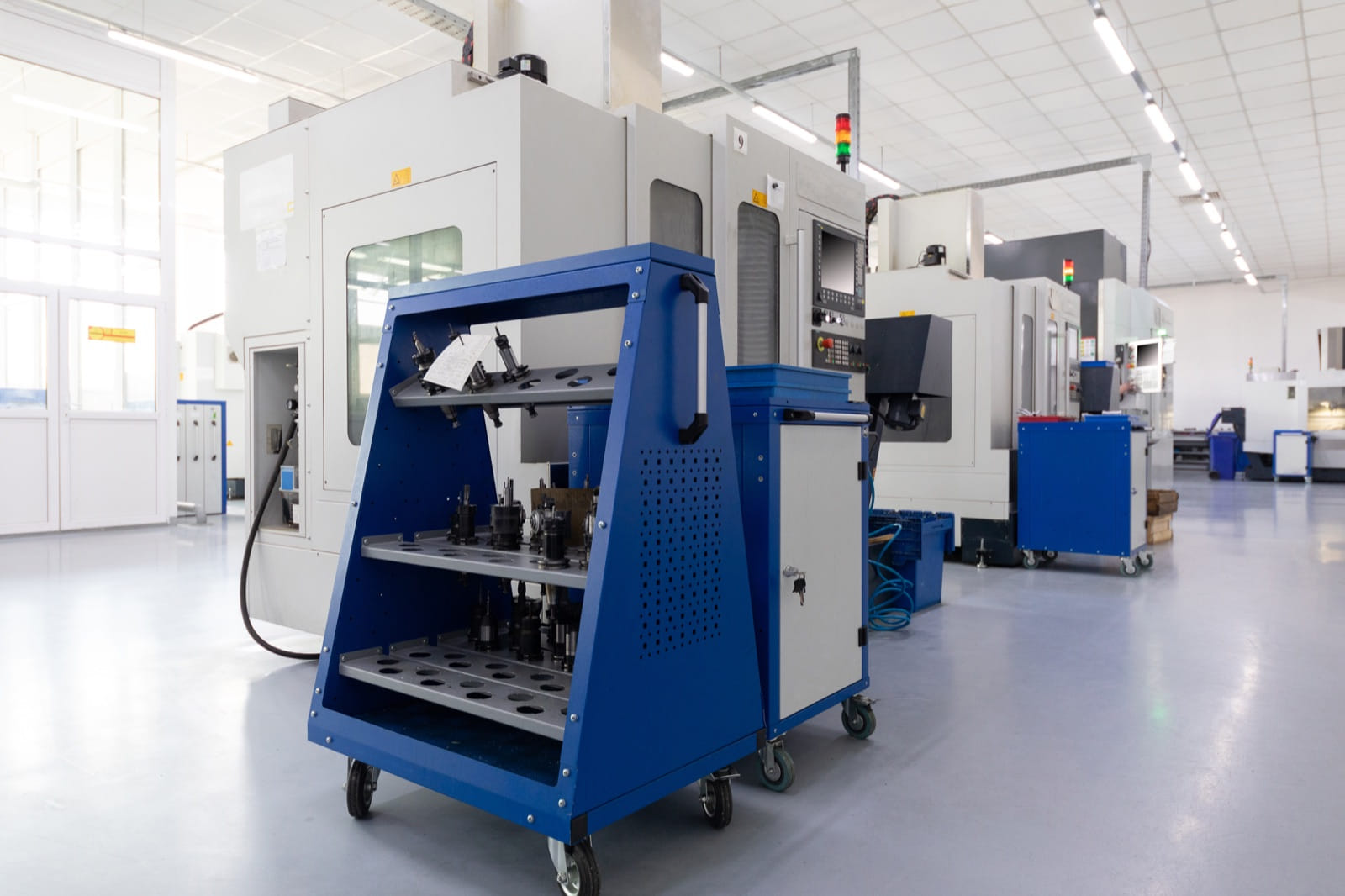 CNC machining center and tooling on a clean manufacturing shop floor