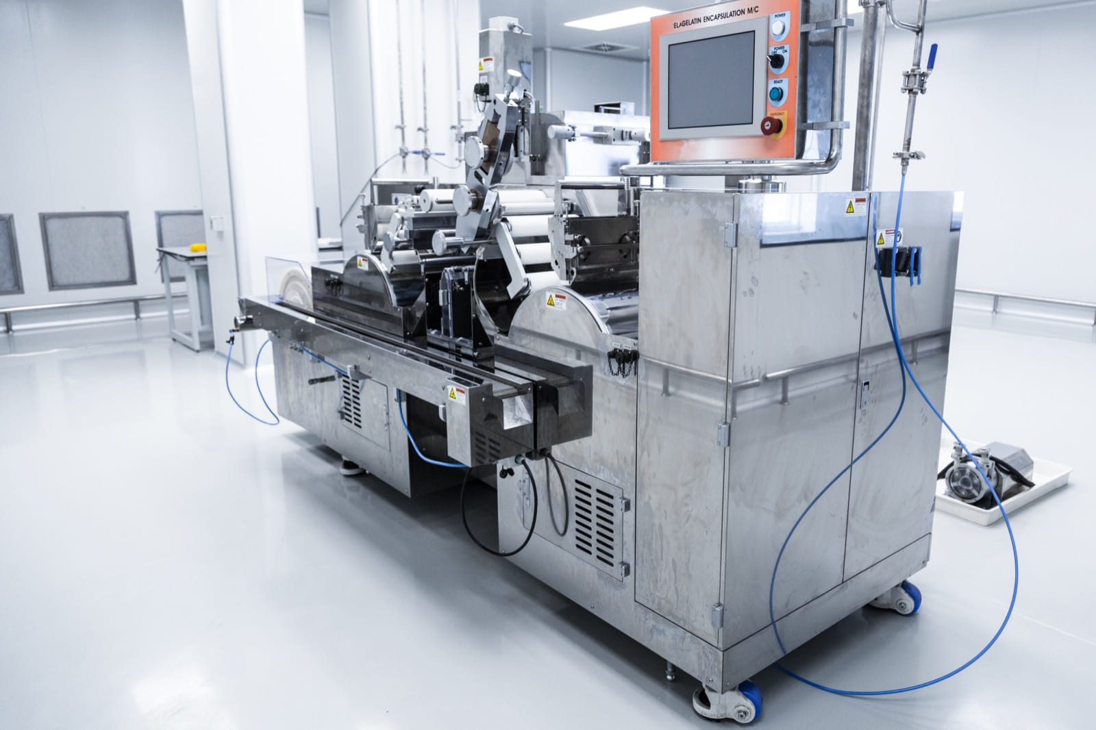 Automated production machine with a control computer in a clean manufacturing facility
