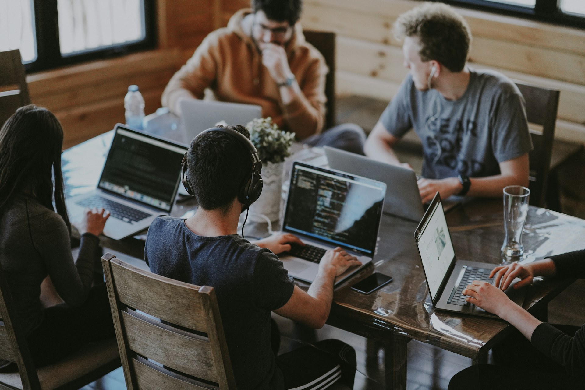 Cross-functional team collaborating on technology strategy with executive CTO guidance